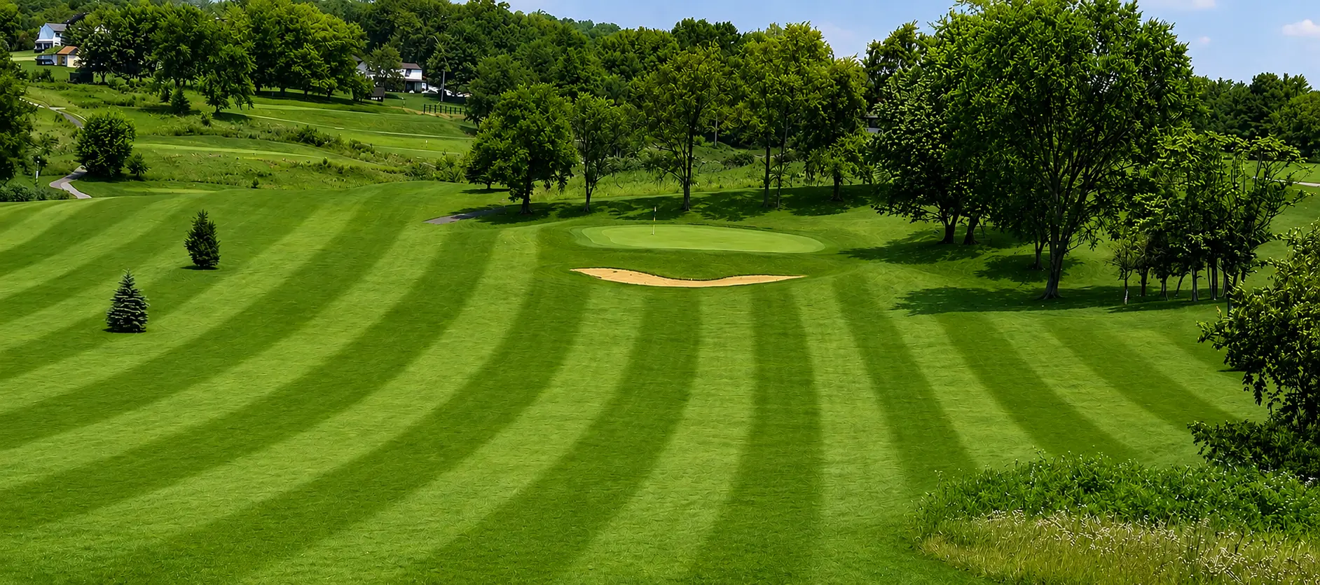 Manicured fairway and green at Indian Run Golf Course